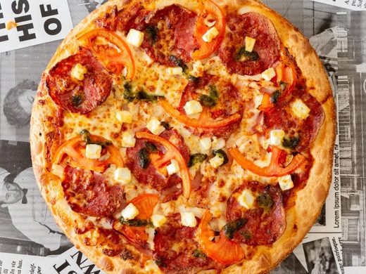 Pluto's Special pizza with chicken, ham, salami, fresh tomato and fetta